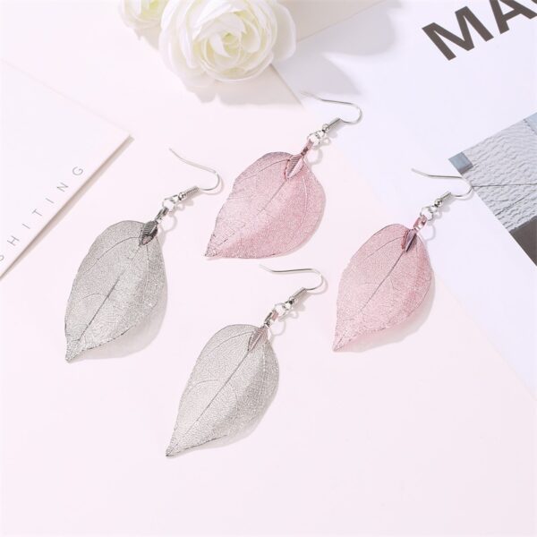 Wholesale Vintage white long hollowed out leaf earrings