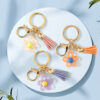 Wholesale Cute hollow sunflower tassel keychain