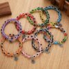 Wholesale alloy palm hollow blue eyes beaded pendant elastic bracelet Charms