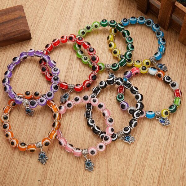 Wholesale alloy palm hollow blue eyes beaded pendant elastic bracelet Charms