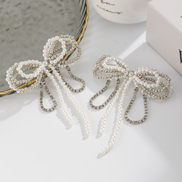 Wholesale Pearl bowknot diamond-encrusted chain tassel necklace