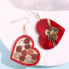 Wholesale Valentine's Day heart-shaped earrings in a rocket-shaped gift box wine red color