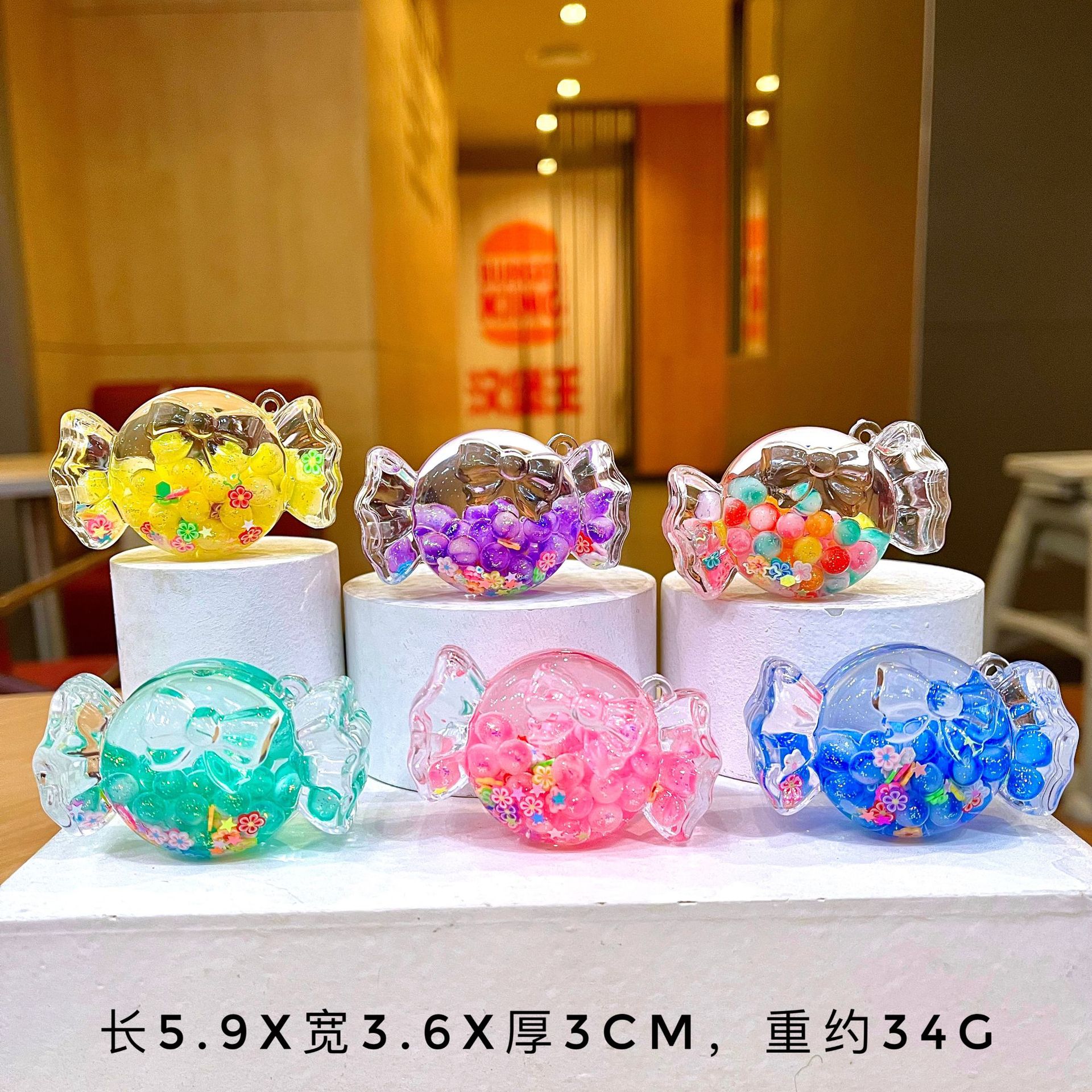 Wholesale Cute colorful candy-filled desktop ornament, quicksand bottle aessory, acrylic keychain, bag charm, small gift.