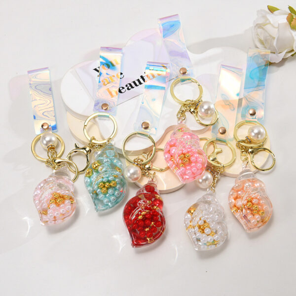 O1CN012wGWL61JM0C4pYarC_2200601031013-0-cib Wholesale Pearl Small Conch Keychain Acrylic