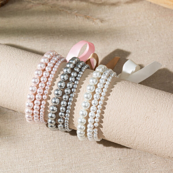 O1CN0140aKi21ZBV0Uhfw2A_2925713156-0-cib Wholesale Bow colored pearl multi-layer layered bracelet