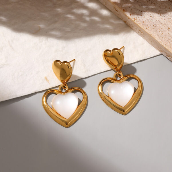Wholesale Stainless steel heart earrings for women inlaid with cat's eye stone