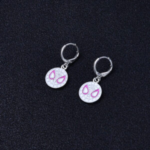 A pair of white earrings