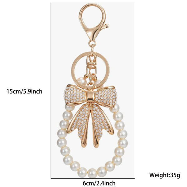 O1CN0175ig0y1PCHcDUbcZI_2218535611804-0-cib Wholesale Diamond studded bow chain pearl bead keychain