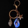 Wholesale Seaside vacation luminous conch metal keychain