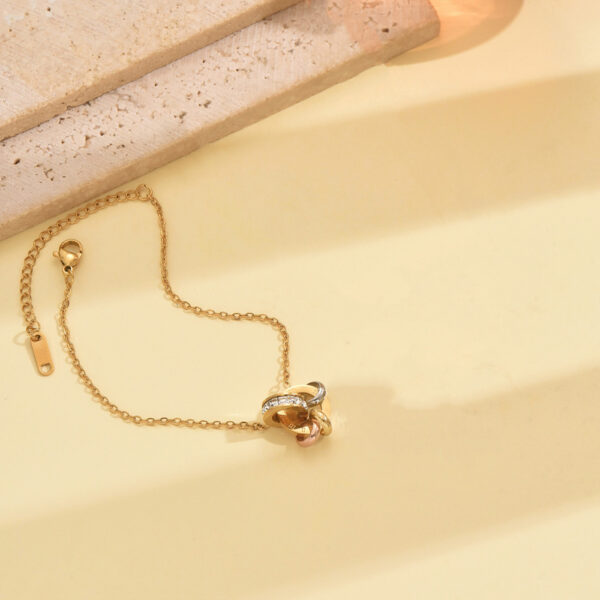 Wholesale Stainless steel gold double-ring linked artificial zircon necklace, bracelet, and earrings