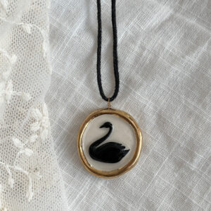 Gold black swan necklace