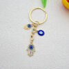 Wholesale Heart-shaped palm water droplet Devil's eye keychain