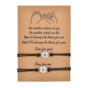 A black and black rope bracelet with card compass