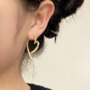 Wholesale Electroplated gold opening heart-shaped earrings