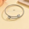 O1CN01BTIUEB1MqBCdwS6Ng_2212889381485-0-cib Wholesale Stainless steel artificial zircon silver open bangle with a twisted design