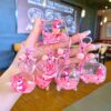 Wholesale Oil filled pink strawberry bear quicksand keychain