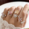 Wholesale Pink flower opening adjustable folding ring