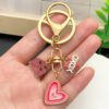 O1CN01ByKnZS2Kpbh5bxy5W_2217654629606-0-cib Wholesale Valentine's Day Heart Envelope Keychain