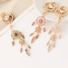 O1CN01C9n3t22A5DMnADm9v_1874418151-0-cib Wholesale Rose gold rhinestone tassel feather dreamcatcher design keychain