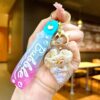 O1CN01CQtsL41ahqhHTDQLa_2214301843362-0-cib Wholesale Colorful flowing sand seashell DIY insert oil keychain