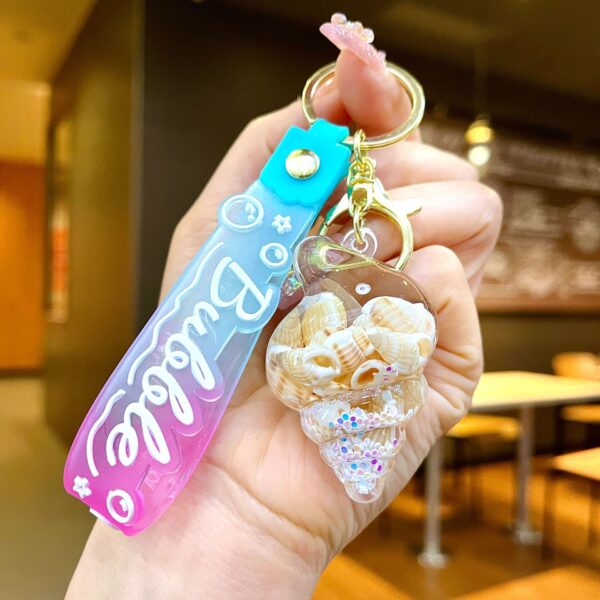 O1CN01CQtsL41ahqhHTDQLa_2214301843362-0-cib Wholesale Colorful flowing sand seashell DIY insert oil keychain