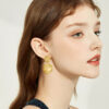 Wholesale Golden circular geometric texture earrings