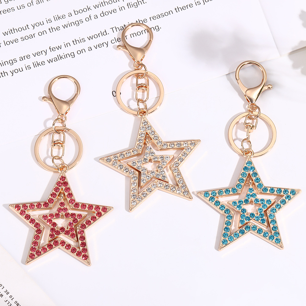 Wholesale Five inted star hollow diamond inlaid metal keychain