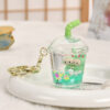 Wholesale Oil-filled acrylic doll cylindrical cup with flowing sand bottle keychain