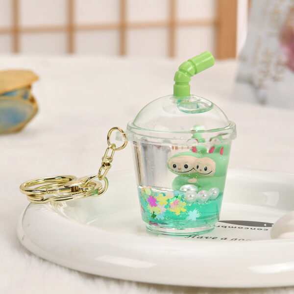 Wholesale Oil-filled acrylic doll cylindrical cup with flowing sand bottle keychain