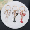 O1CN01DsoHse2Kpbcvq7cYT_2217654629606-0-cib Wholesale Top hat, high heels pearl keychain