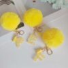 Wholesale Yellow letter ball pendant flower shaped letter keychain