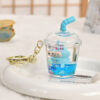 Wholesale Oil-filled acrylic doll cylindrical cup with flowing sand bottle keychain