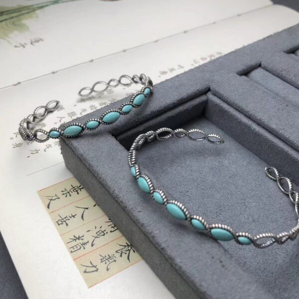O1CN01Eb47zg2DriAl5uGeO_2215705608663-0-cib Wholesale Western style circle cross Fried Dough Twists shaped turquoise bracelet