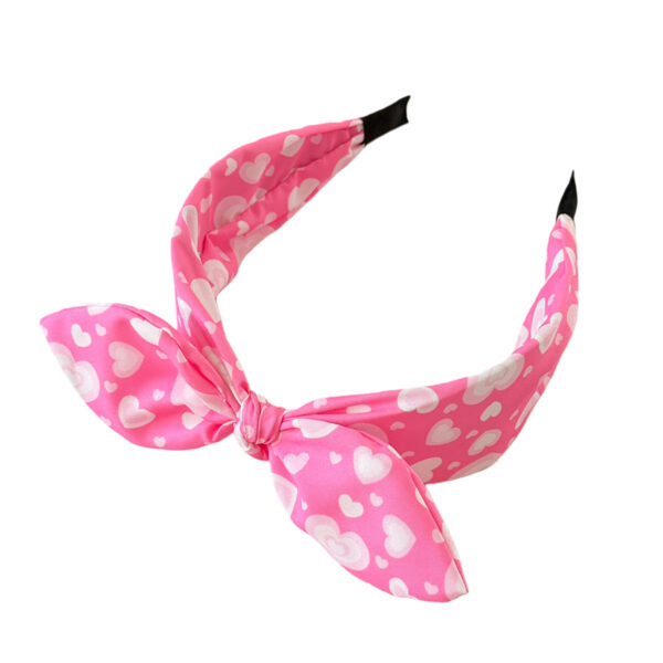 Wholesale Valentine's Day headband with bow, bunny ears, and a pink heart shape