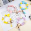 Wholesale daisy silicone printed wooden bead keychain bracelet key pendant