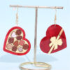 Wholesale Valentine's Day heart-shaped earrings in a rocket-shaped gift box wine red color
