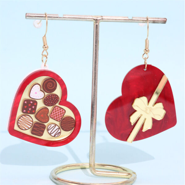 Wholesale Valentine's Day heart-shaped earrings in a rocket-shaped gift box wine red color