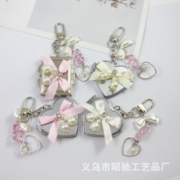 O1CN01H4xFq520vkgY2iLVD_2550186912-0-cib Wholesale Colorful Bow Love Mirror Metal Keychain