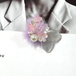 One purple goldfish bead