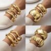 O1CN01I6qcbd1lWouGBzvWv_2218670844827-0-cib Wholesale Golden wide edged wave band exaggerated bracelet