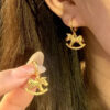Wholesale Golden crushed ice rocking horse earrings