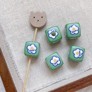 6 # Five-petal flower on green background (one)