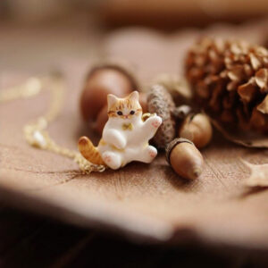 Orange and white cat necklace