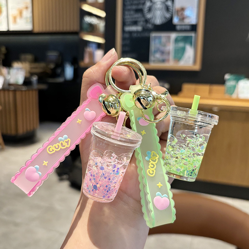 Wholesale quicksand luminous c keychain liquid oil ift bottle pendant