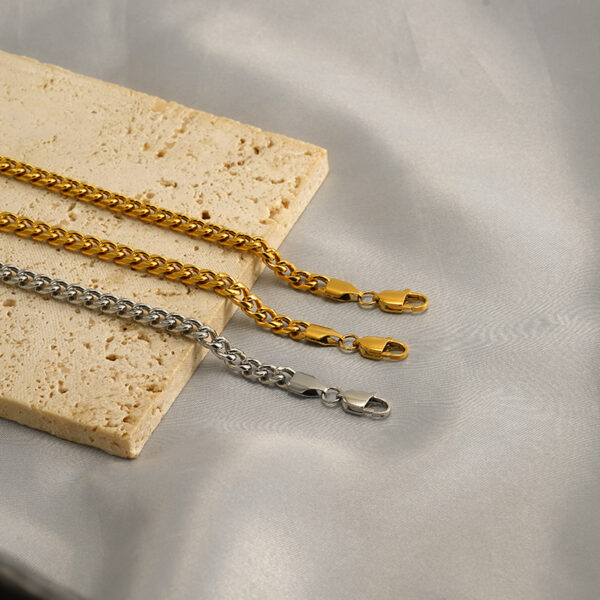 O1CN01J5QJ4f2NGHvJDatNs_2217889189935-0-cib Wholesale Titanium steel interlocking rings gold and silver bracelet