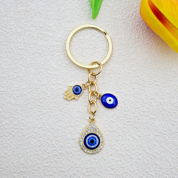Wholesale Heart-shaped palm water droplet Devil's eye keychain