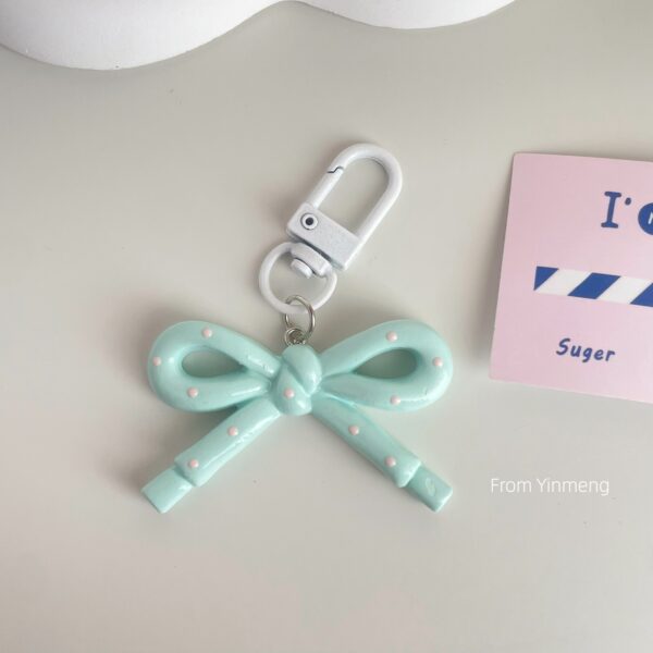 Wholesale spring and summer candy-colored hollow butterfly bow keychain