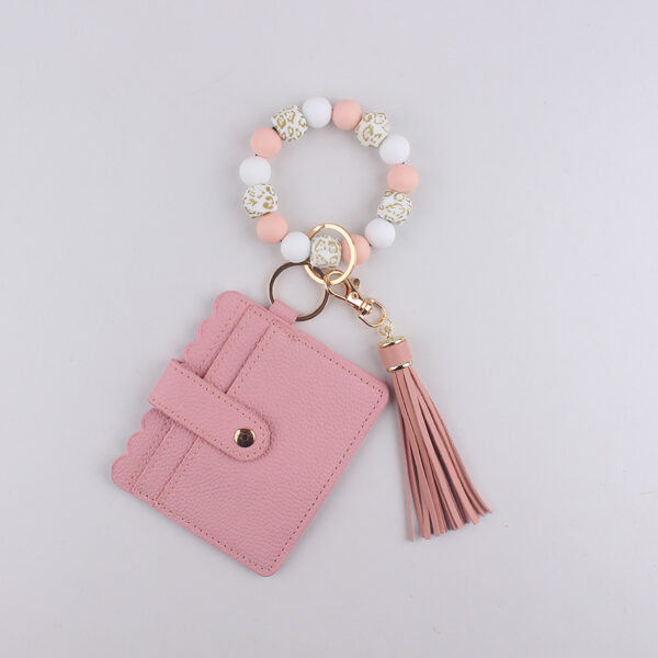 O1CN01L3uekr1NrNval0gTe_2214899881623-0-cib Wholesale Silicone Bracelet Solid Color Card Holder and keychain.