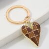 Wholesale Amazon checkered alloy heart personalized devil's eye keychain