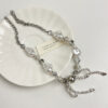 Wholesale Sparkling pearl bow tassel necklace